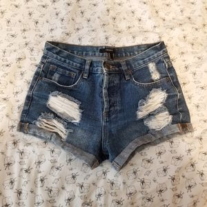 Mid rise distressed denim shorts